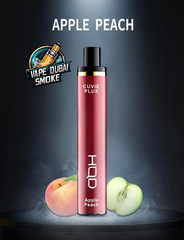 HQD Cuvie Plus Apple Peach disposable vape displayed with fresh peach and sliced green apple