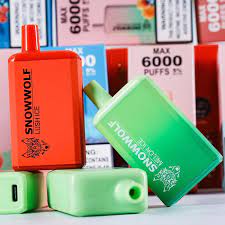 Snowwolf Max 6000 puffs disposable vapes in red and green colors with boxes
