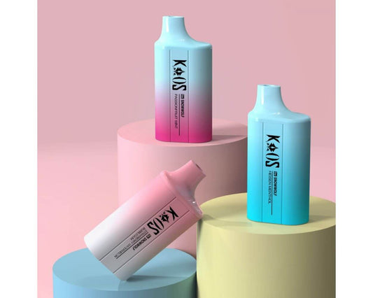 Kaos by SnowWolf 6000 disposable vape trio in gradient pastel colors on podium