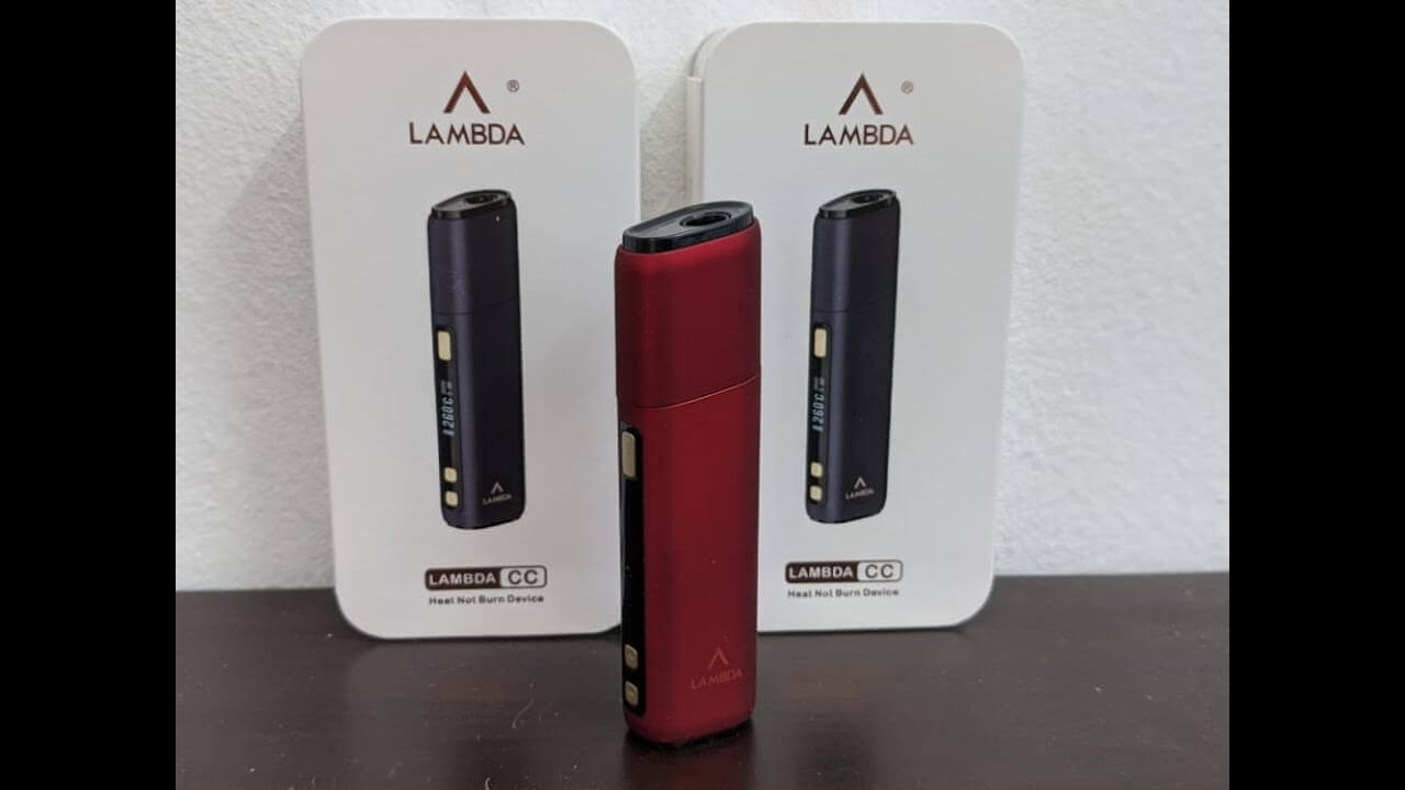 Lambda CC heat-not-burn device in red and black with retail packaging boxes