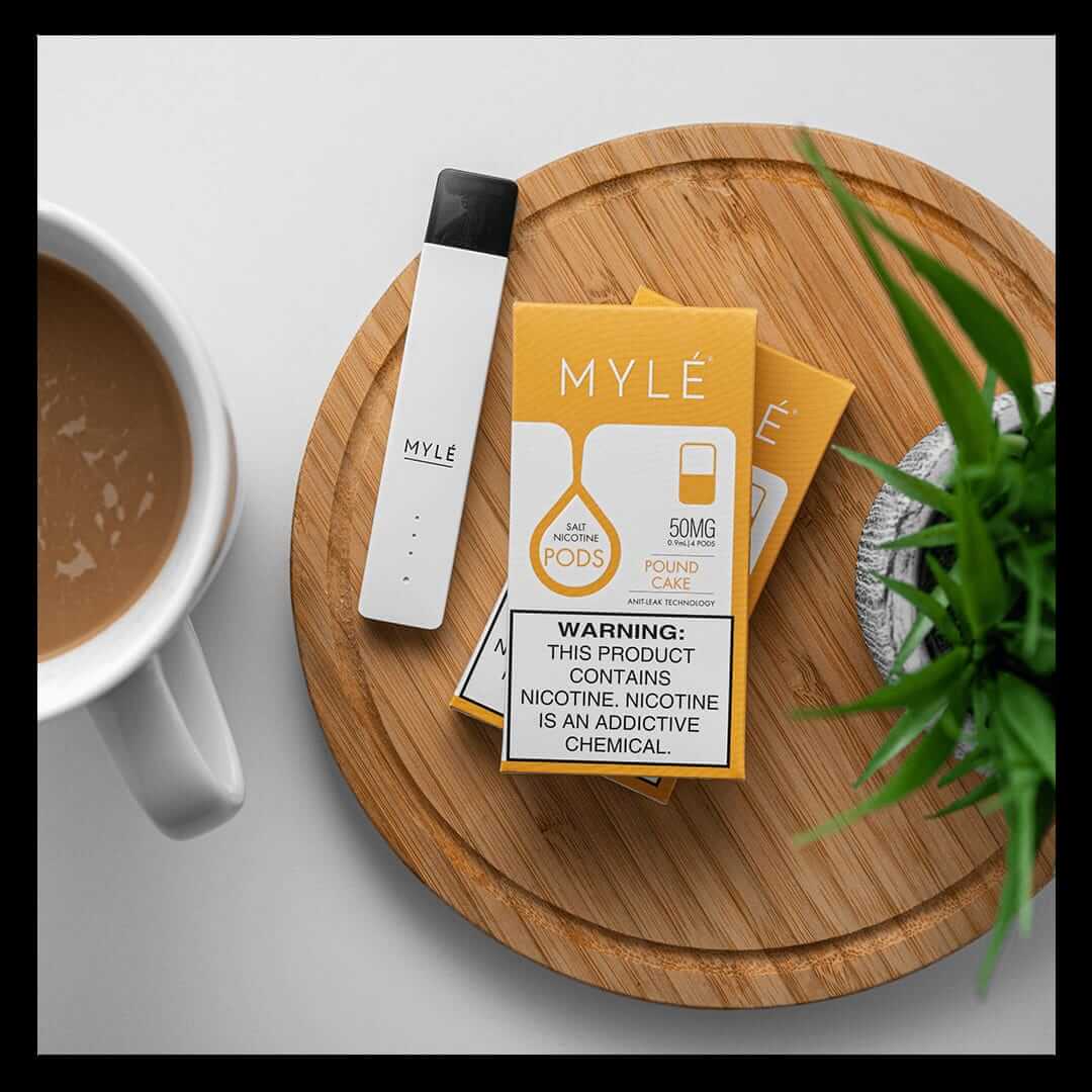 MYLÉ Pound Cake 50mg pods with white device on tray.